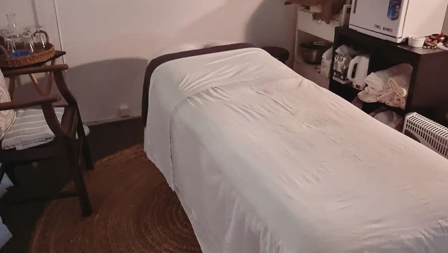Massage room at Self Mind & Body in Dunedin, Otago, NZ featuring a cozy massage table and tranquil ambiance.