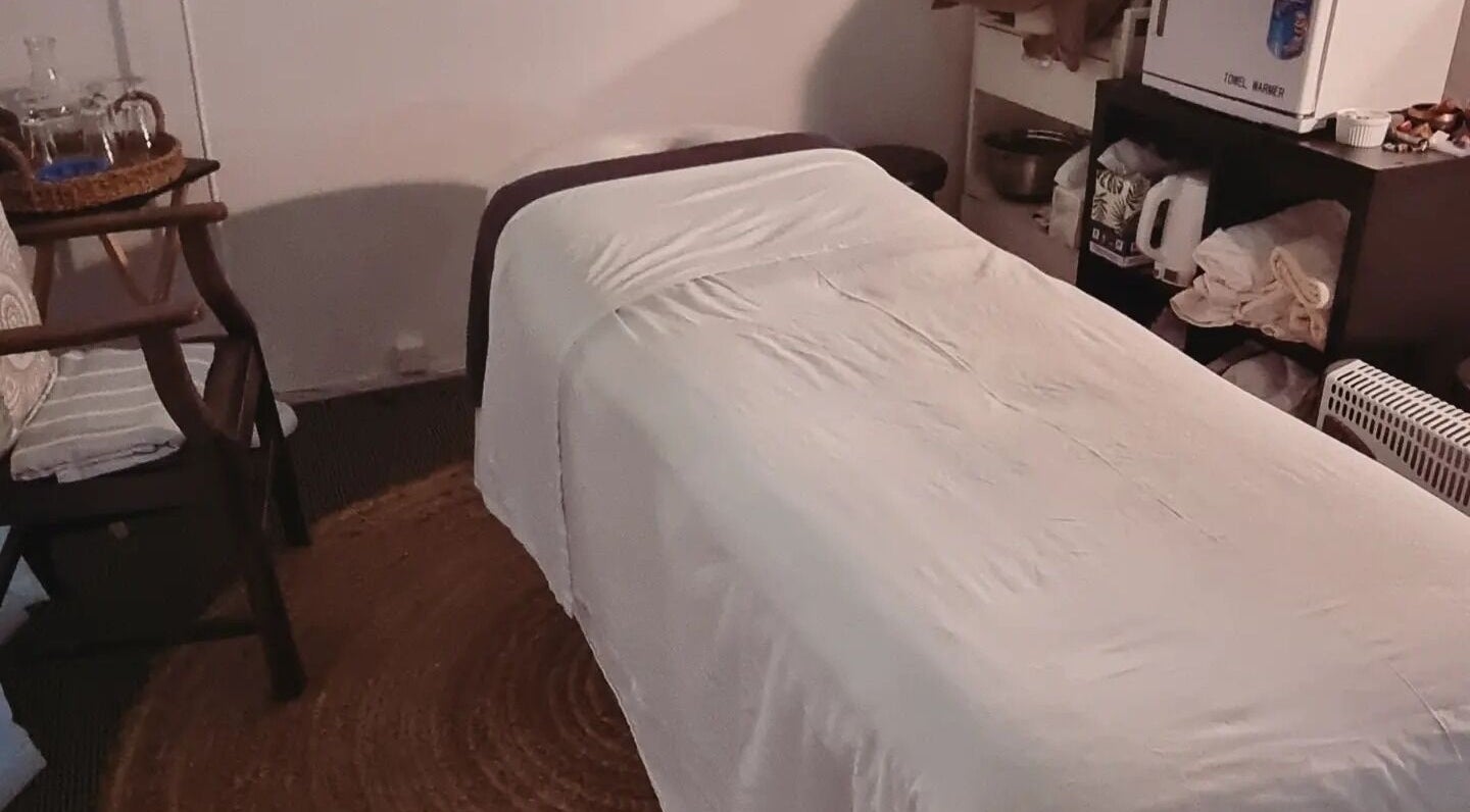 Massage room at Self Mind & Body in Dunedin, Otago, NZ featuring a cozy massage table and tranquil ambiance.
