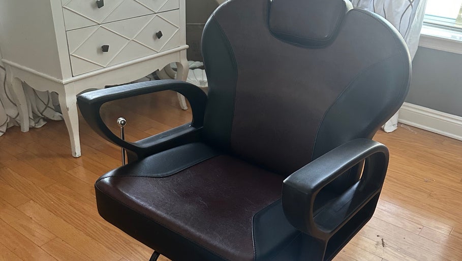 A stylish salon chair at Moxie, Hair by Amy in Panama City, Florida, US, perfect for modern hair styling.