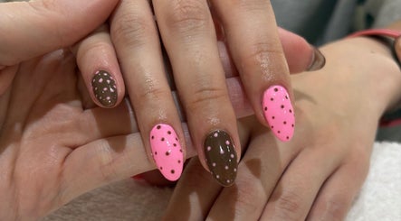 Pink and brown polka dot nail art at Beauty Boss, Dublin, County Dublin, IE, showcasing intricate design.