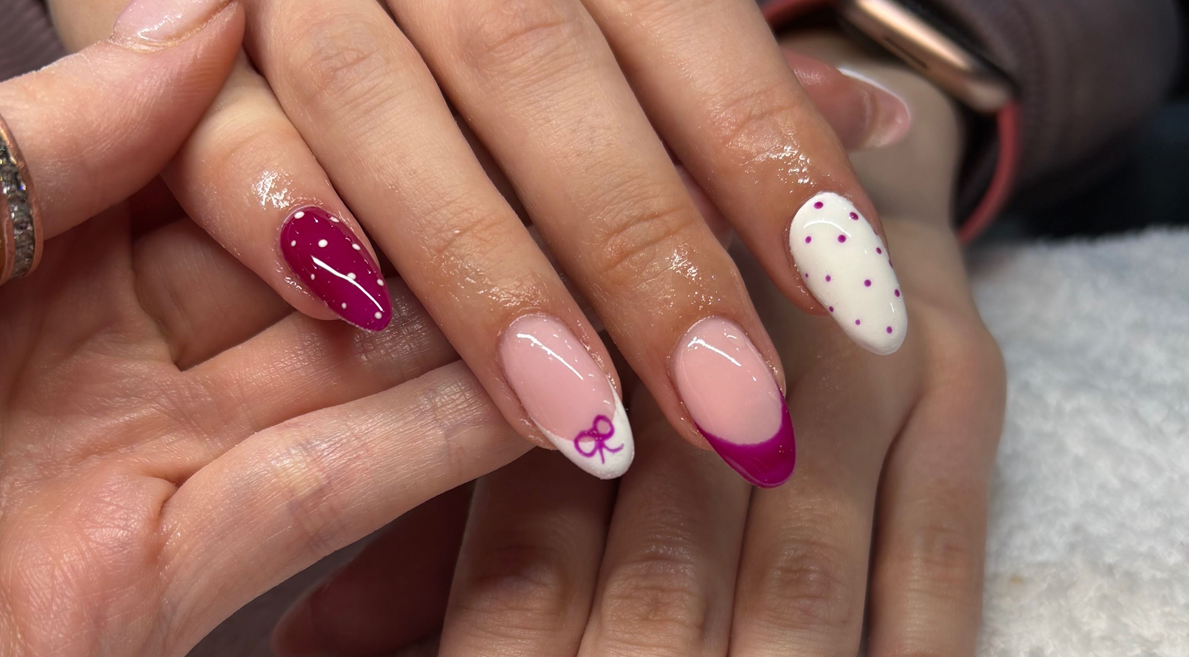 Elegant nail art at Beauty Boss, Dublin, County Dublin, IE with pink and white designs.