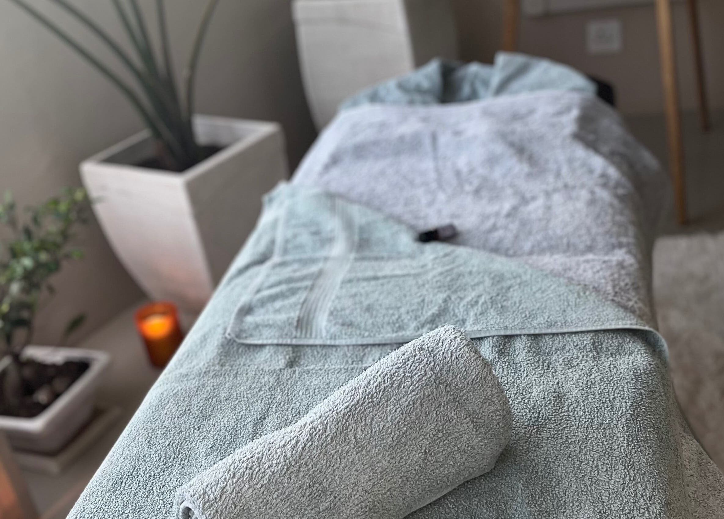 Relaxing spa setup at Zama’s Mobile Therapy, Tongaat, Kwazulu-natal, ZA, with towels and plants.