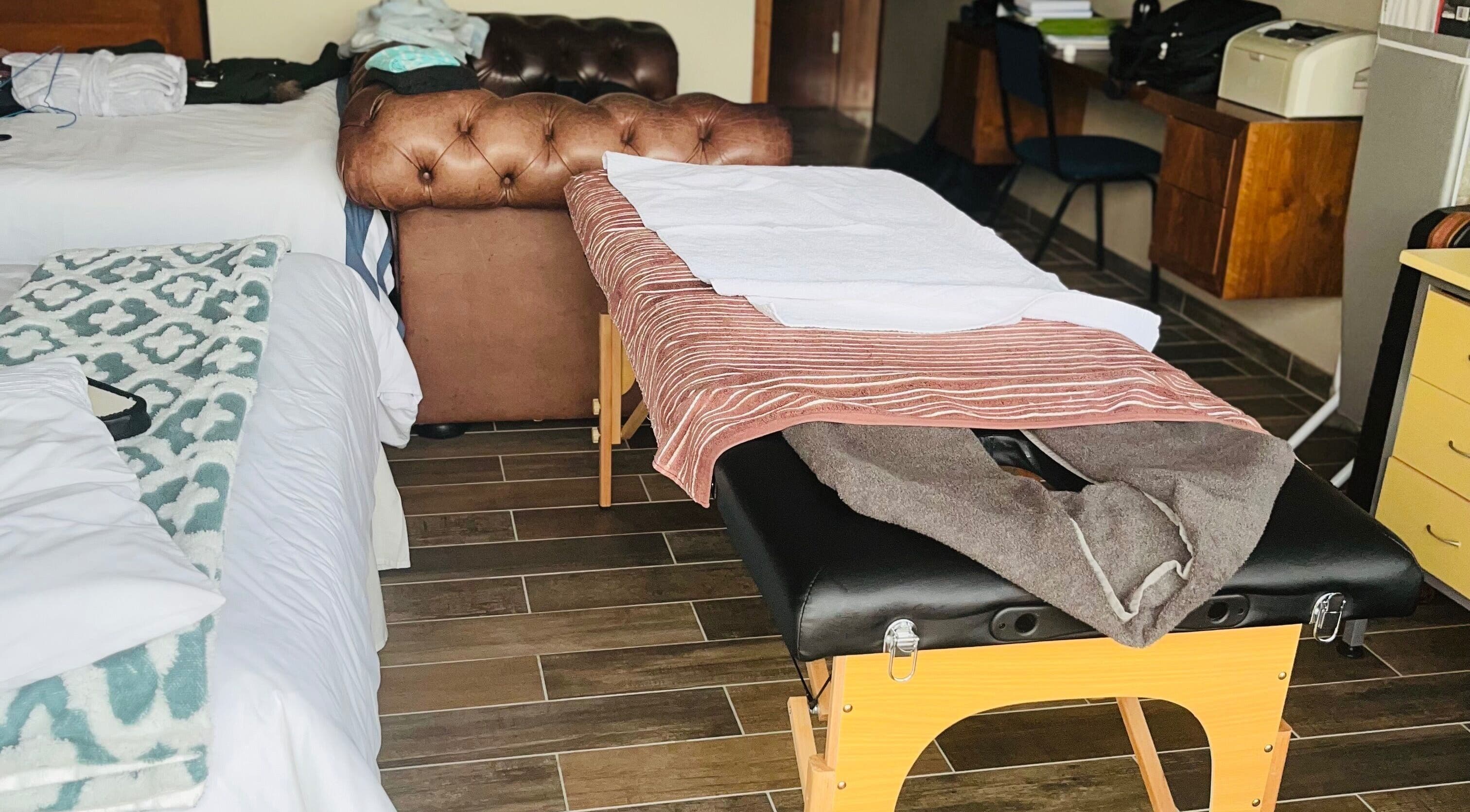 Massage table setup at Zama’s Mobile Therapy, Tongaat, Kwazulu-natal, ZA, offering a serene wellness experience.