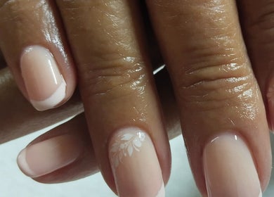 Close-up of elegant nail art at Magnolia Beauty, Springs, Gauteng, ZA, showcasing delicate floral designs.