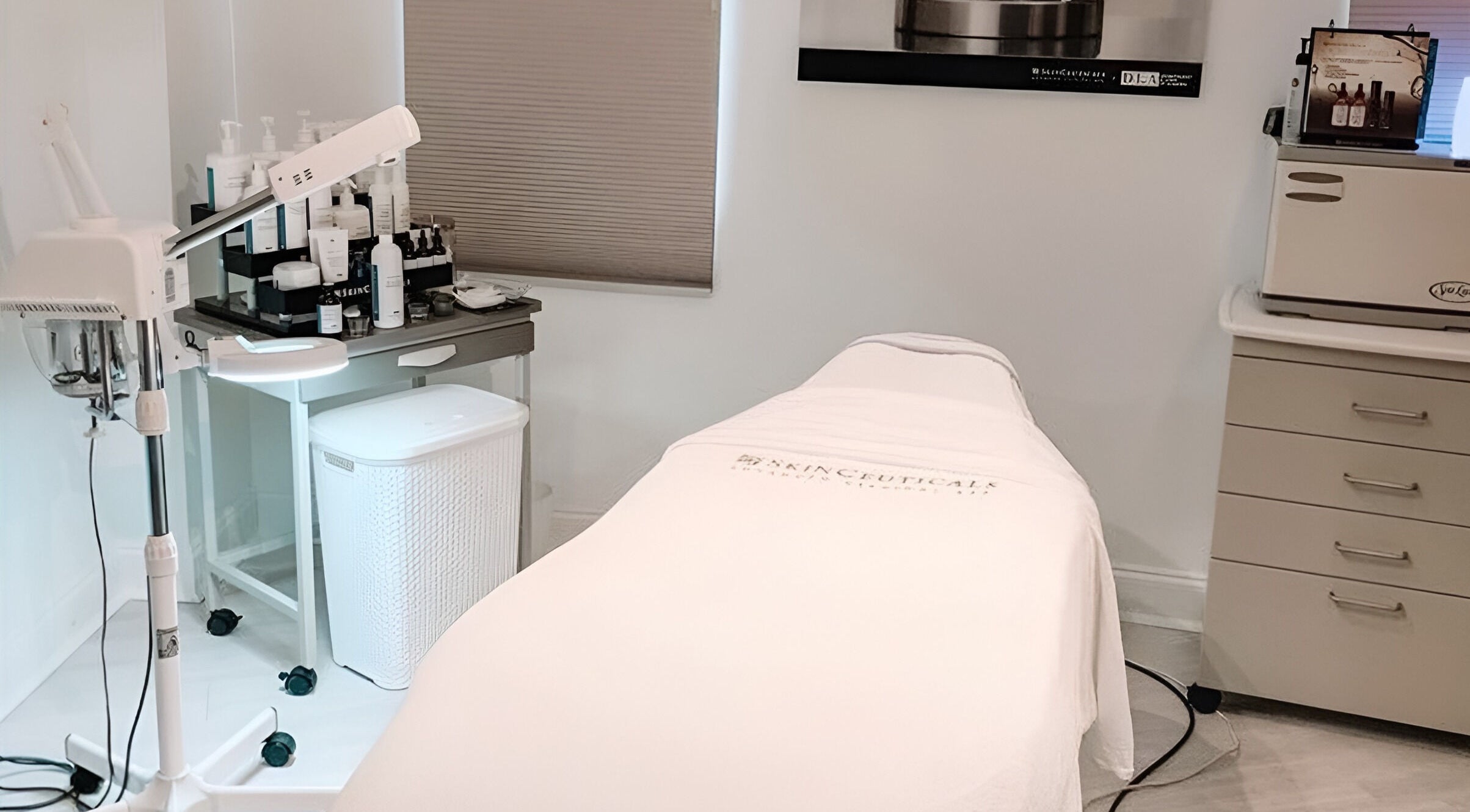 Treatment room at Laser & Skin Clinic by Aigre Bloom, Toronto, Ontario, CA, showcasing professional skincare setup.