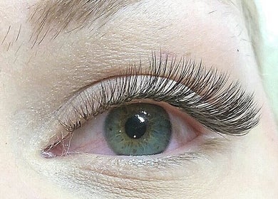 Close-up of enhanced eyelashes at Enigma Prestige Beauty, Newbury, England, GB showcasing expert lash extension.