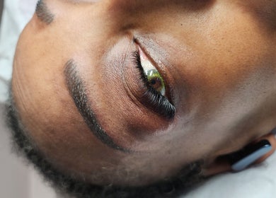 Close-up of eye with long lashes at Enigma Prestige Beauty, Newbury, England, GB.