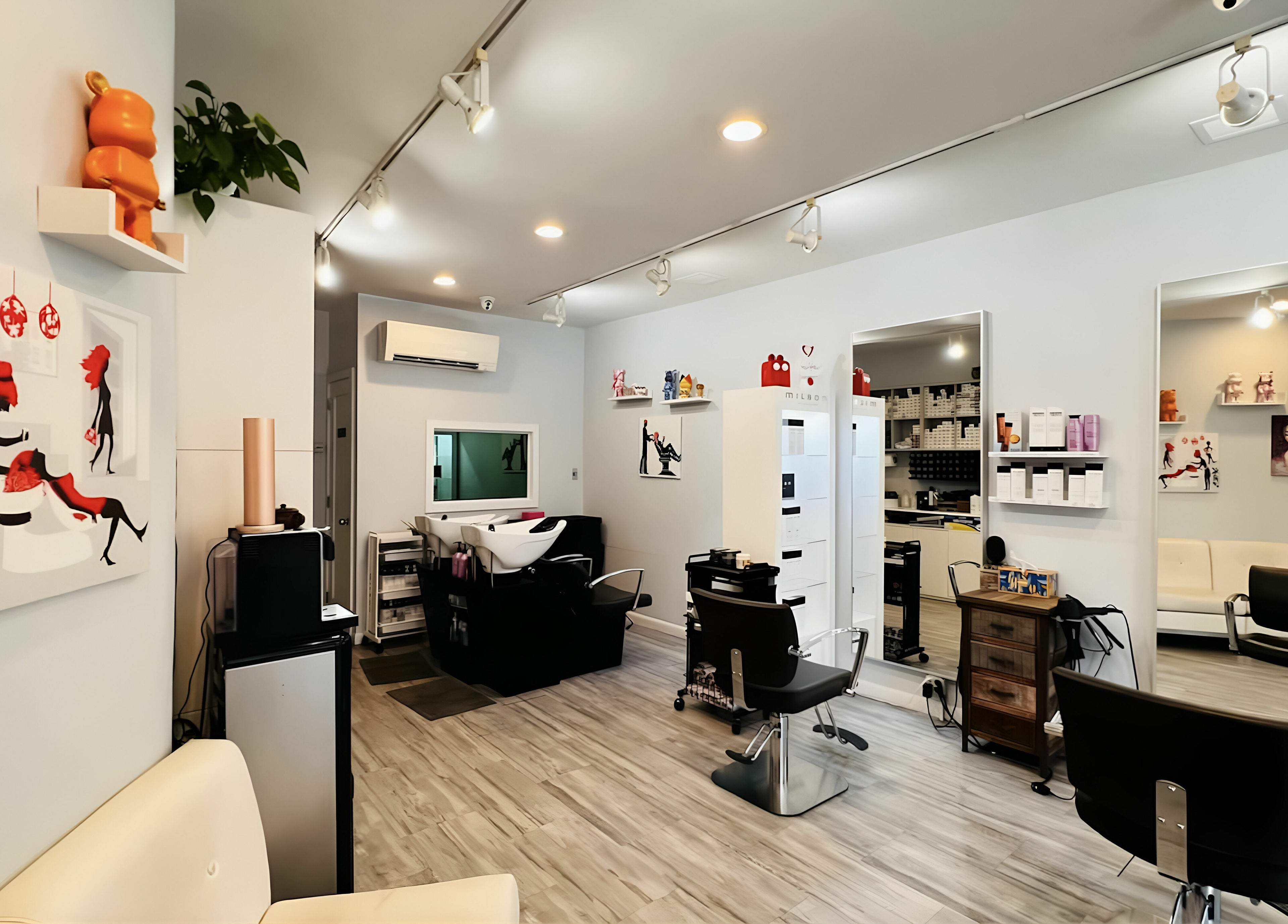 Modern interior of R Hair Studio in New York, New York, US with stylish decor and salon chairs.
