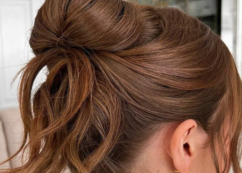 Chic elegant bun hairstyle at R Hair Studio, New York, New York, US showcasing sleek hair styling.