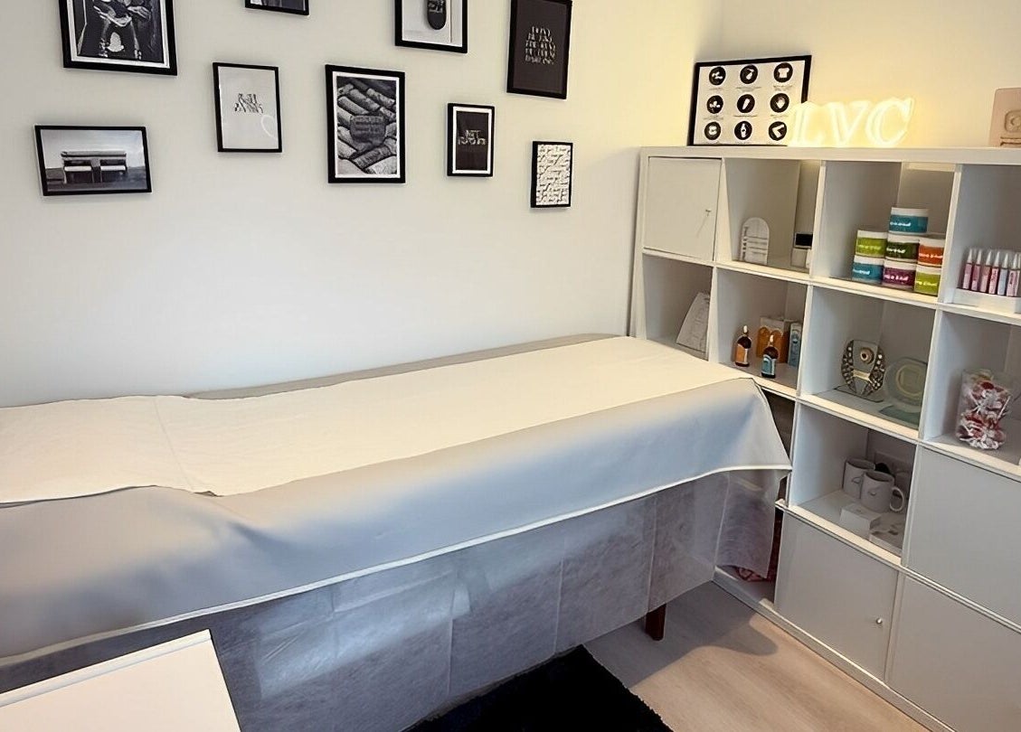 Cozy therapy room at LVC Beauty, Aberdeen, Scotland, GB, featuring treatment bed and wellness products.