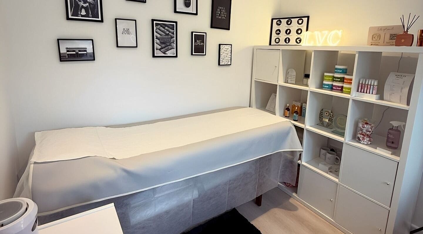 Cozy therapy room at LVC Beauty, Aberdeen, Scotland, GB, featuring treatment bed and wellness products.