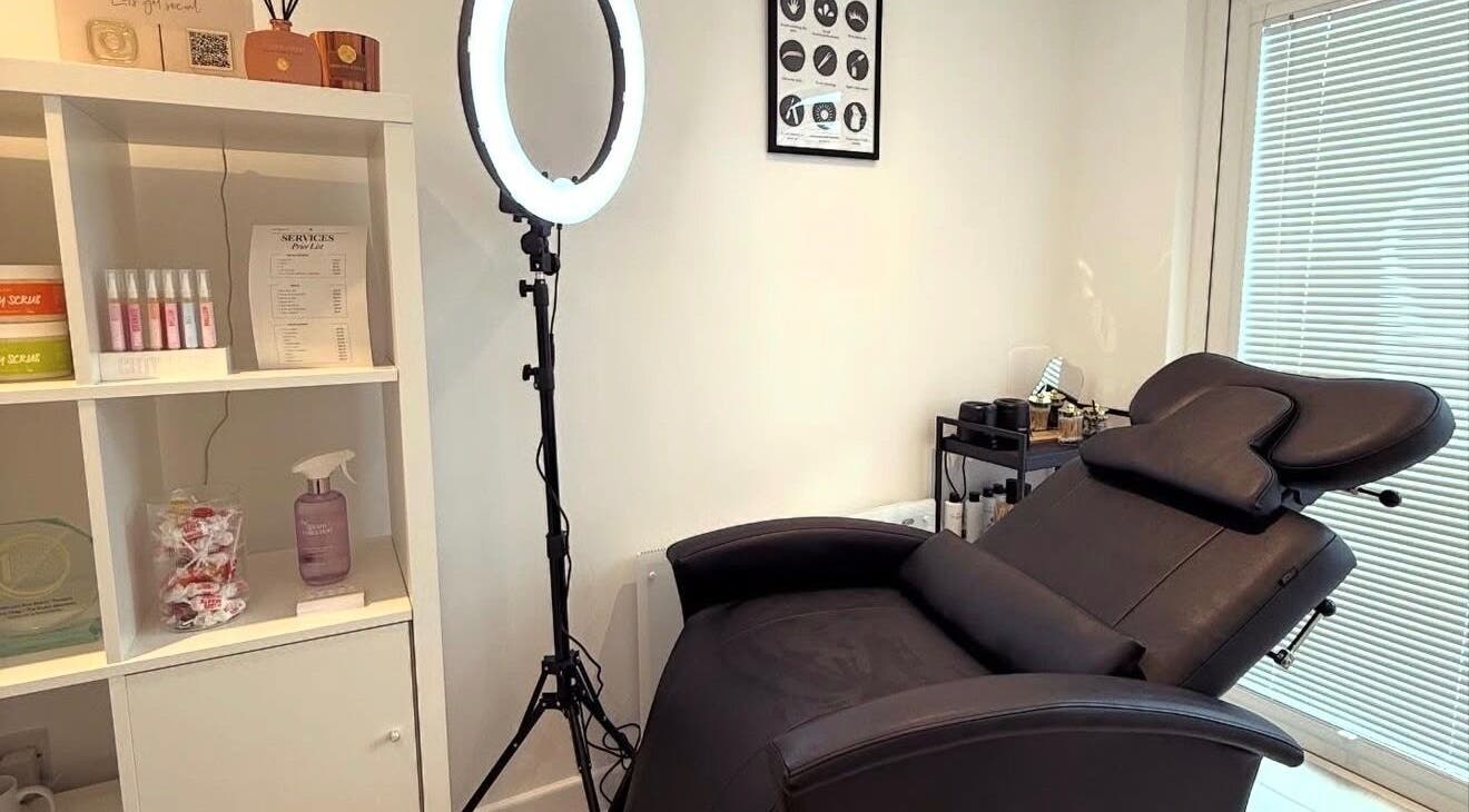 Relaxing treatment room at LVC Beauty, Aberdeen, Scotland, GB, featuring a reclining chair and soft lighting.