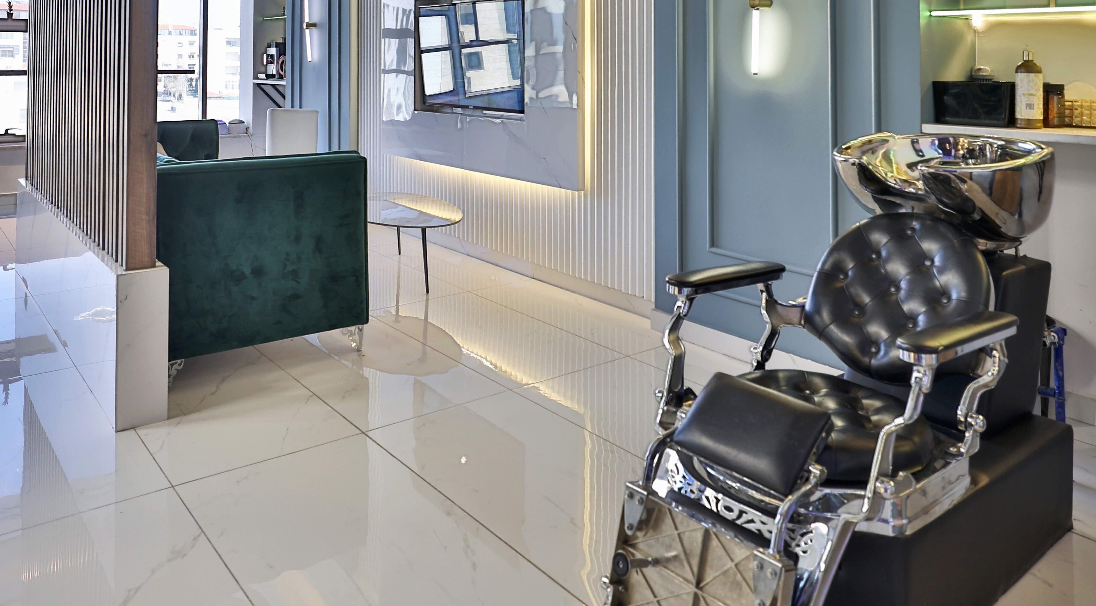 Luxurious interior at Signature Men's Spa By Mostafa, Amman with modern design and sleek furnishings.