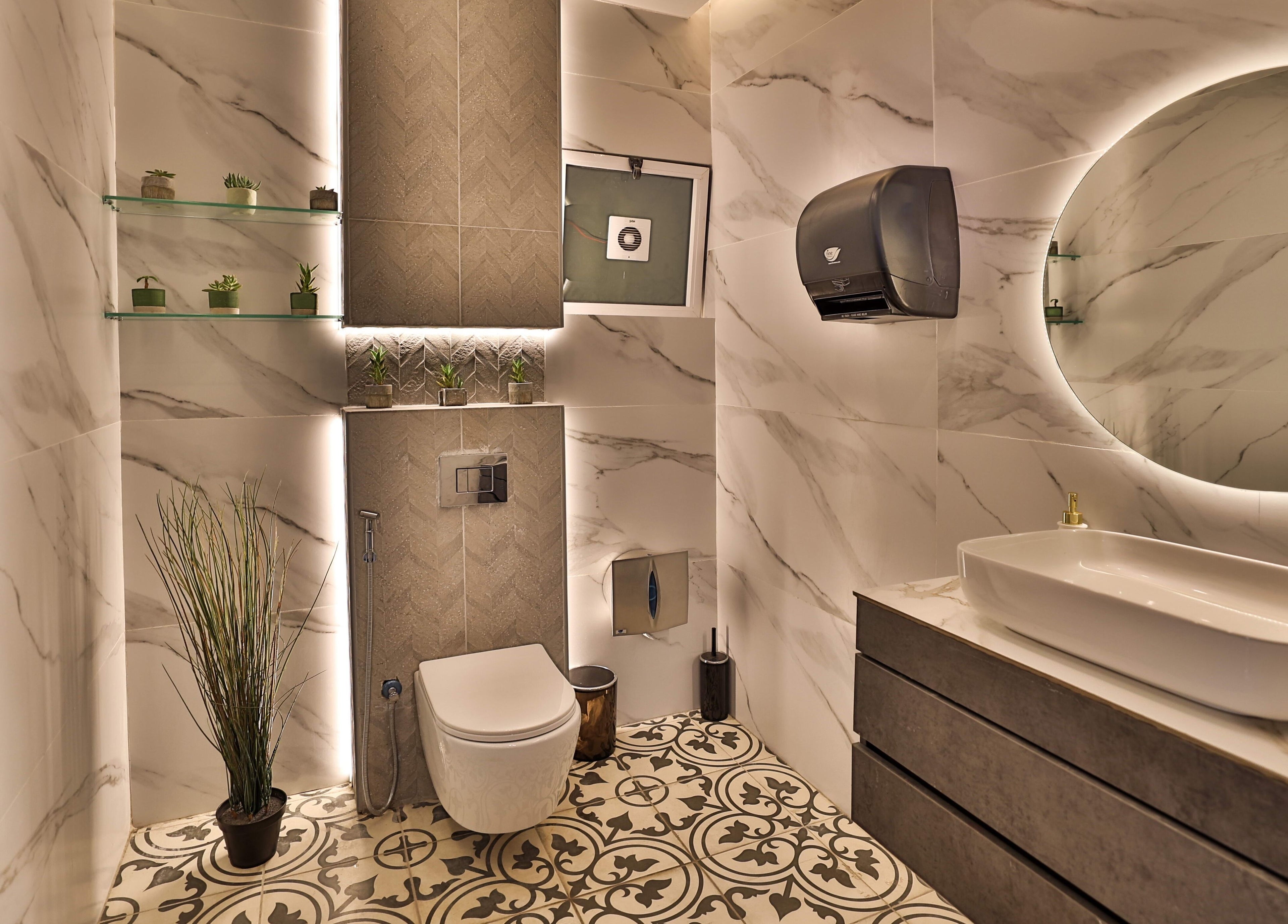 Luxurious restroom at Signature Men's Spa By Mostafa in Amman, JO with modern fixtures and lighting.