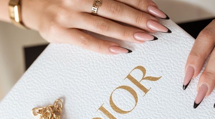 Elegant manicure with black tips at ProBeauty, Virginia Beach, Virginia, US.