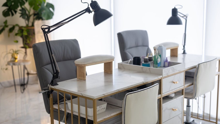 Modern manicure station at ProBeauty, Virginia Beach, Virginia, US, featuring sleek chairs and organized supplies.