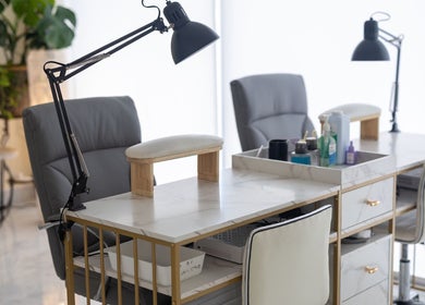 Modern manicure station at ProBeauty, Virginia Beach, Virginia, US, featuring sleek chairs and organized supplies.