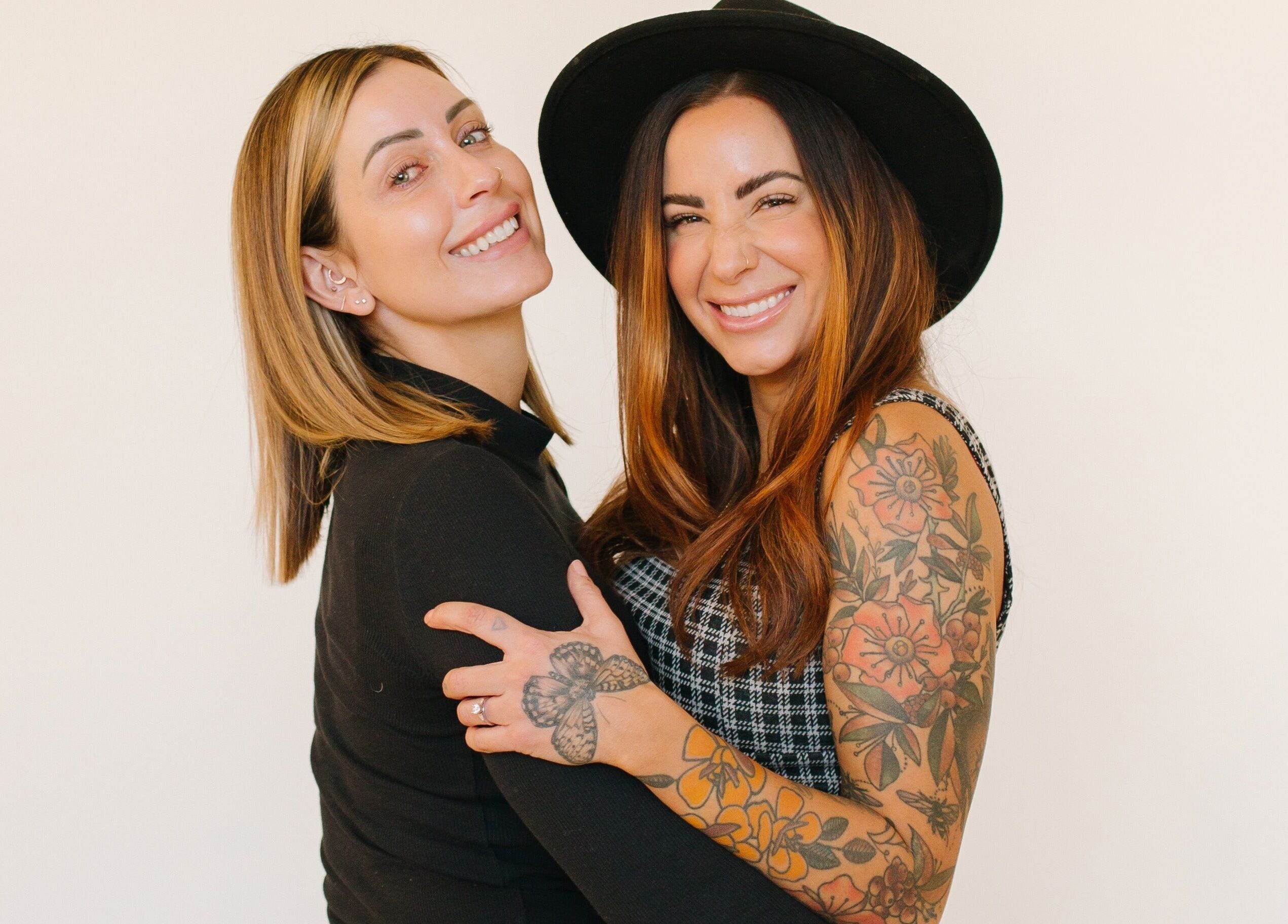 Two smiling women at Lemon's Esthetics Studio in South Jordan, Utah, US, showcasing a friendly and welcoming atmosphere.