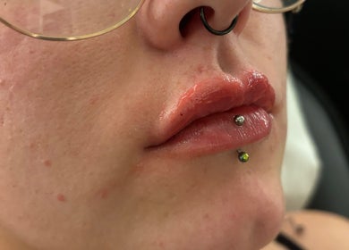 Close-up of lip and piercing at Ivy Beauty Lounge @ Cloud Nine, Chesterfield, England, GB highlighting modern style.