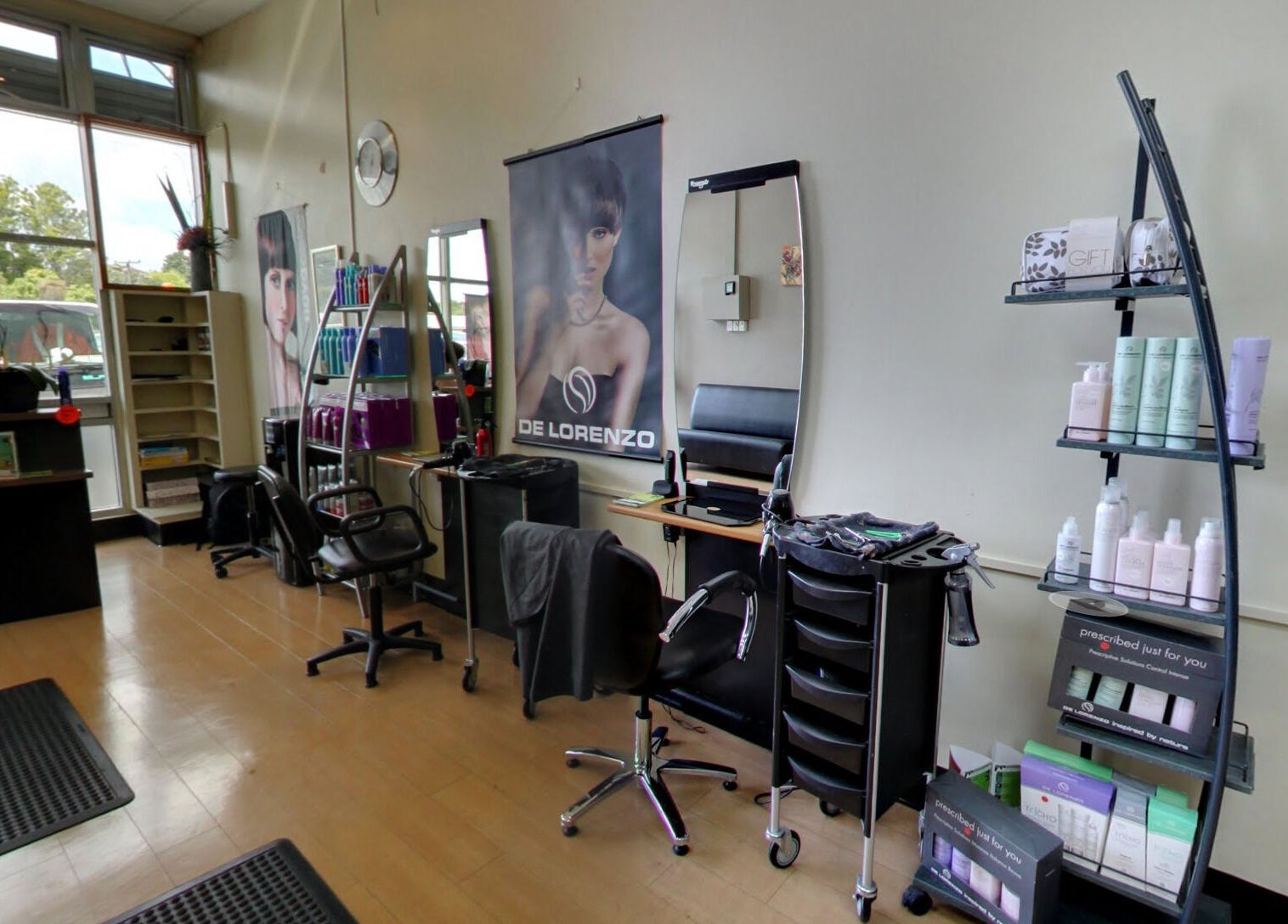 Styleworks salon interior in Auckland, NZ. Features modern styling stations and product display shelves.