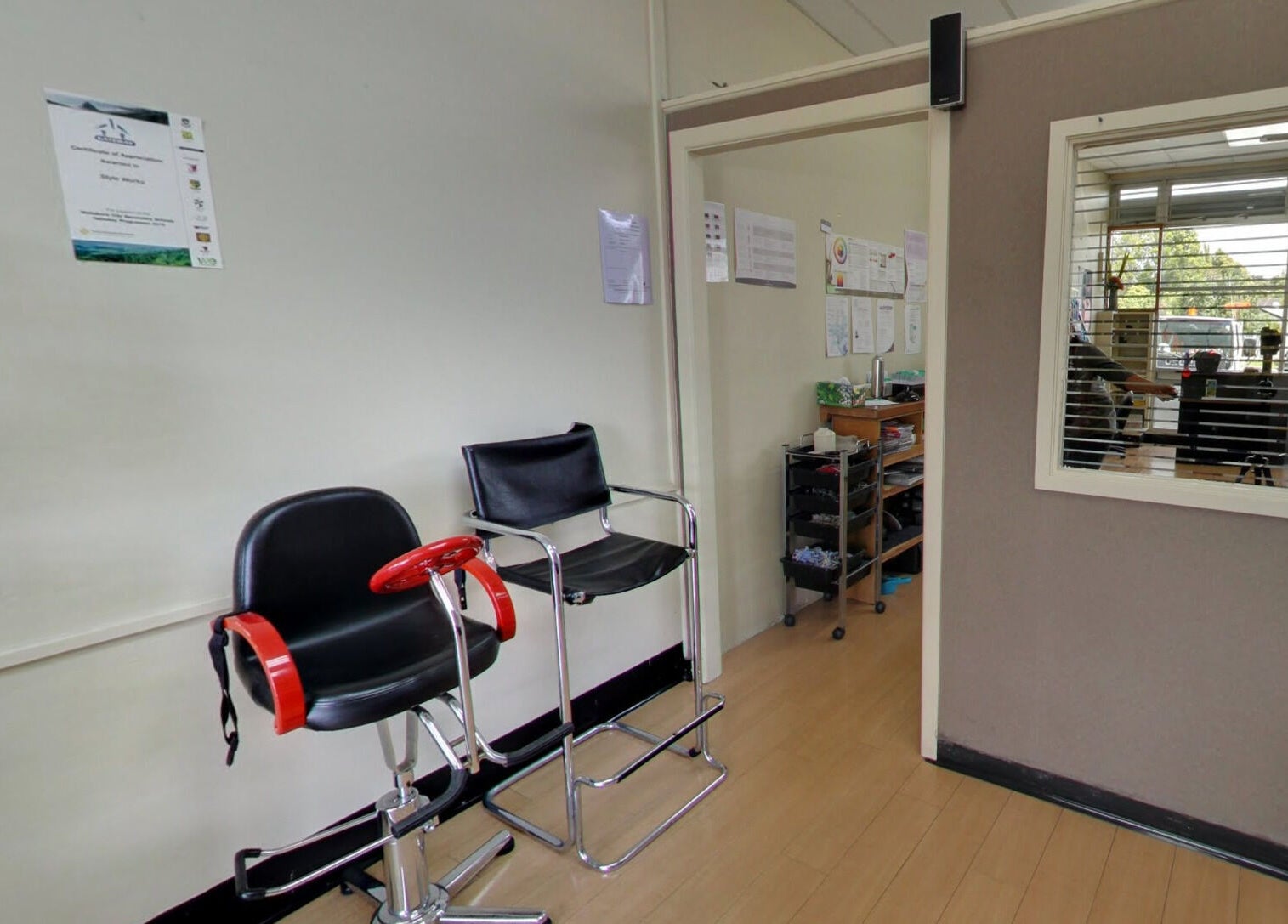 Interior view of Styleworks salon at Auckland, NZ showcasing stylish chairs and serene decor.