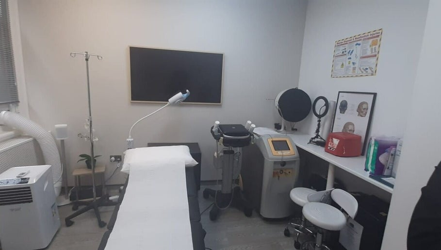 Treatment room in Skin and Aesthetics by Danugur showcasing modern equipment, London, England, GB.