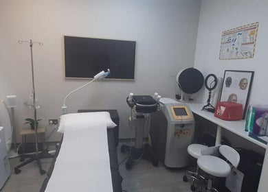 Treatment room in Skin and Aesthetics by Danugur showcasing modern equipment, London, England, GB.