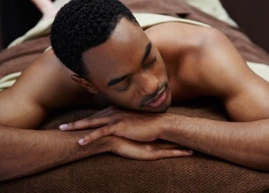 Man enjoys a calming massage at Skin and Aesthetics by Danugur, London, England, GB.