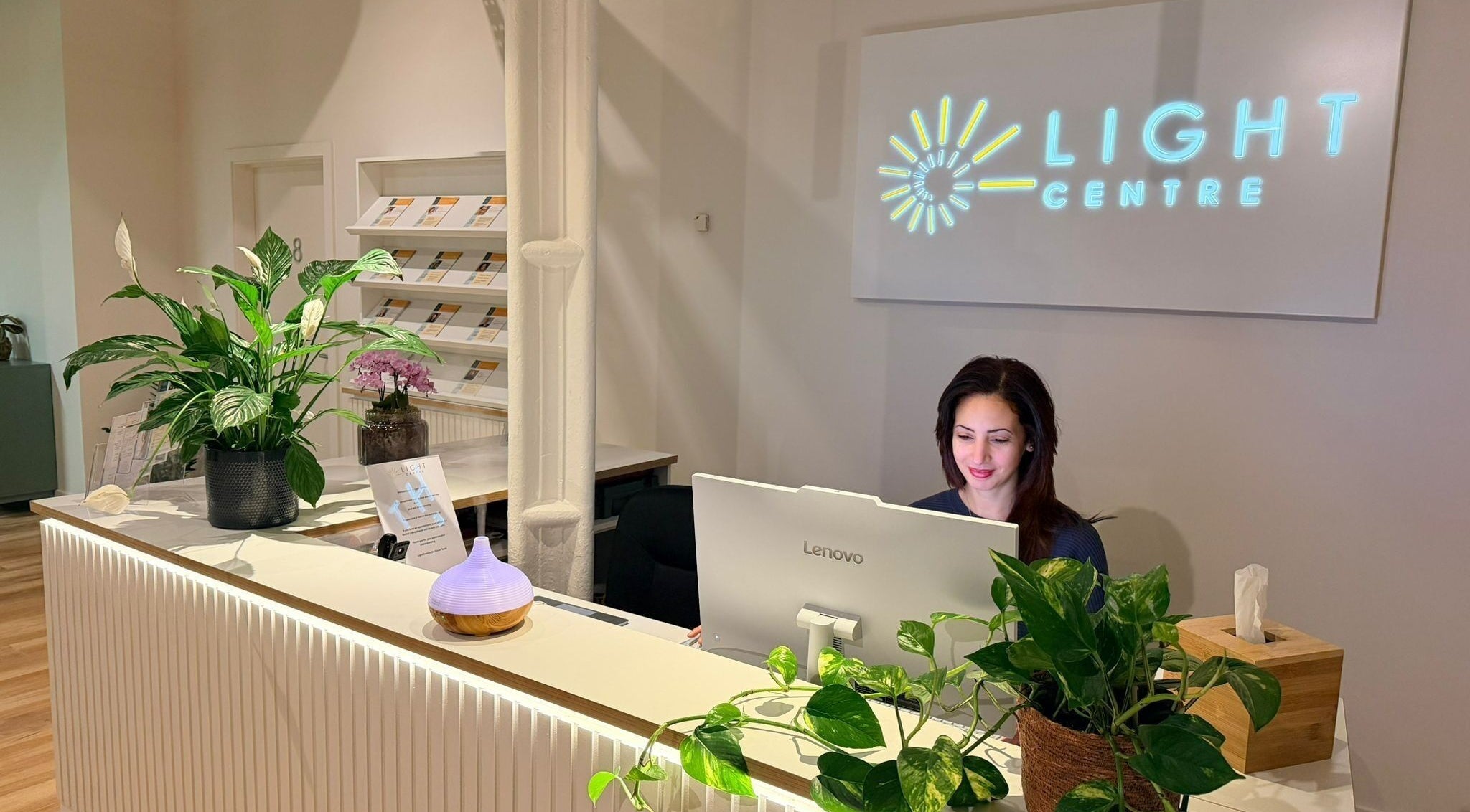 Reception area with smiling staff at Danugur Old Street, London, England, GB. Bright, inviting decor.
