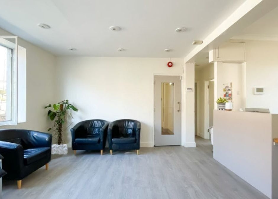 Bright, inviting reception at Danugur Clapham-Stockwell, London, England, GB with plush seating and modern decor.