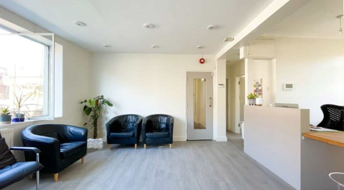 Bright, inviting reception at Danugur Clapham-Stockwell, London, England, GB with plush seating and modern decor.