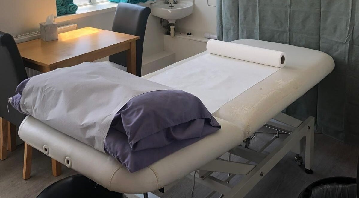 Comfortable massage table at Danugur Clapham-Stockwell, London, England, GB, in a serene room setup.