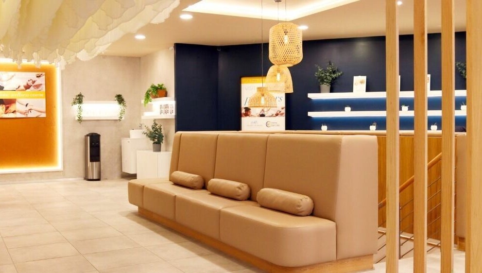 Modern reception area at Mean (Men) Mareylebone, London, England, GB, with warm lighting and contemporary decor.