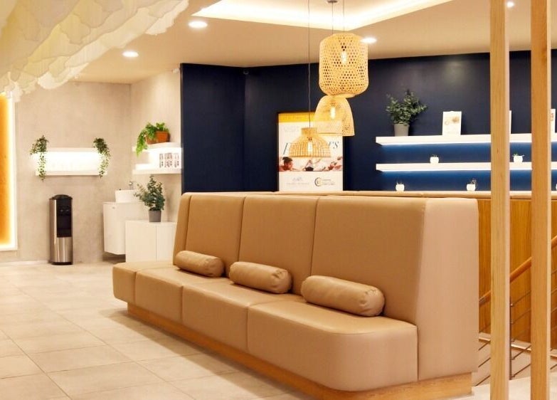 Modern reception area at Mean (Men) Mareylebone, London, England, GB, with warm lighting and contemporary decor.