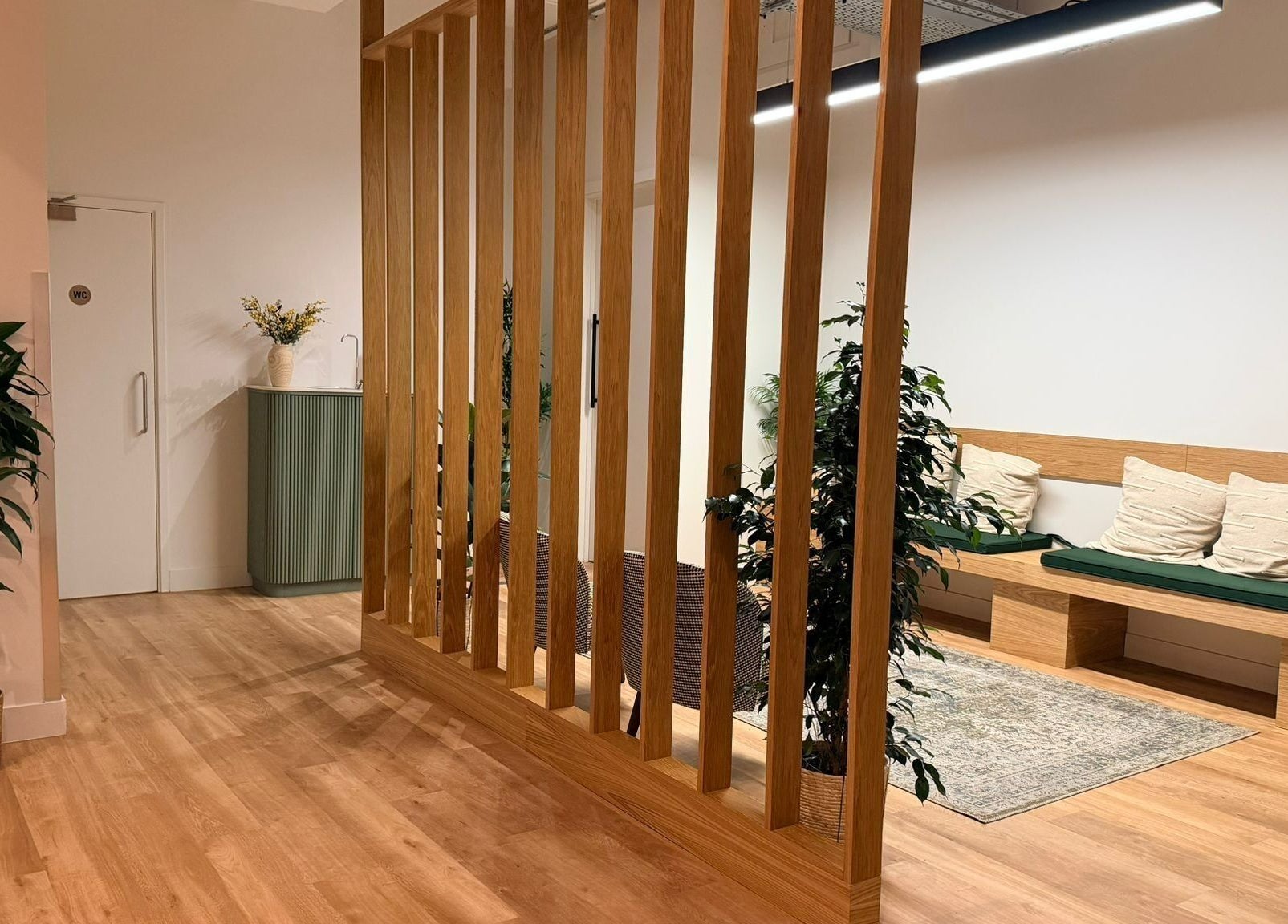 Elegant waiting area with wooden decor at Maen (Men) Old Street, London, England, GB.