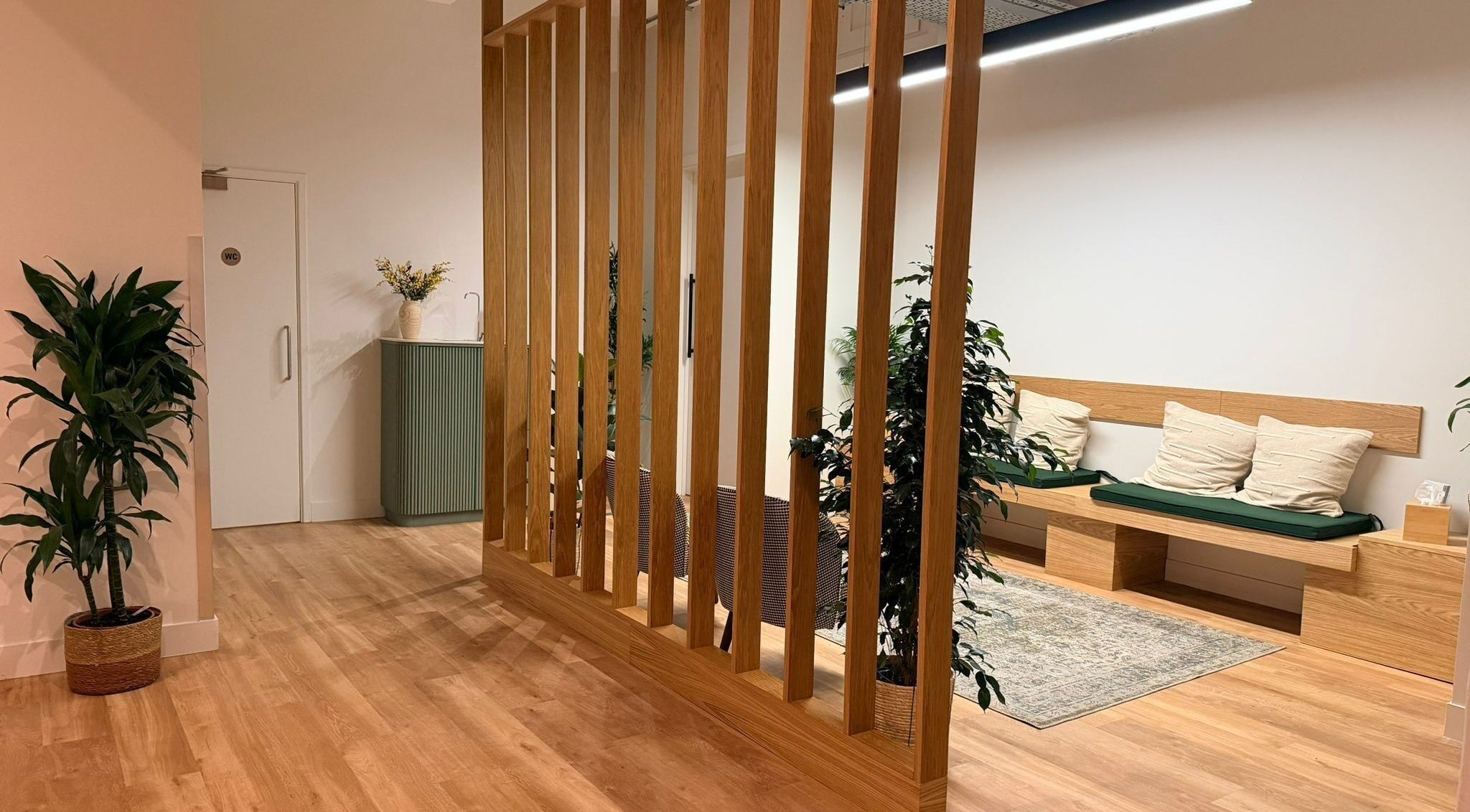 Elegant waiting area with wooden decor at Maen (Men) Old Street, London, England, GB.