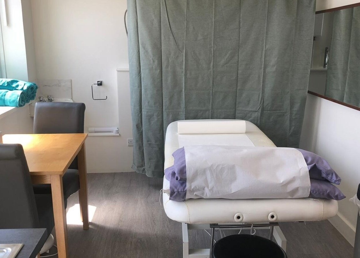 Treatment room at Maen (Men) London Clapham, featuring a massage table and natural light, London, England, GB.