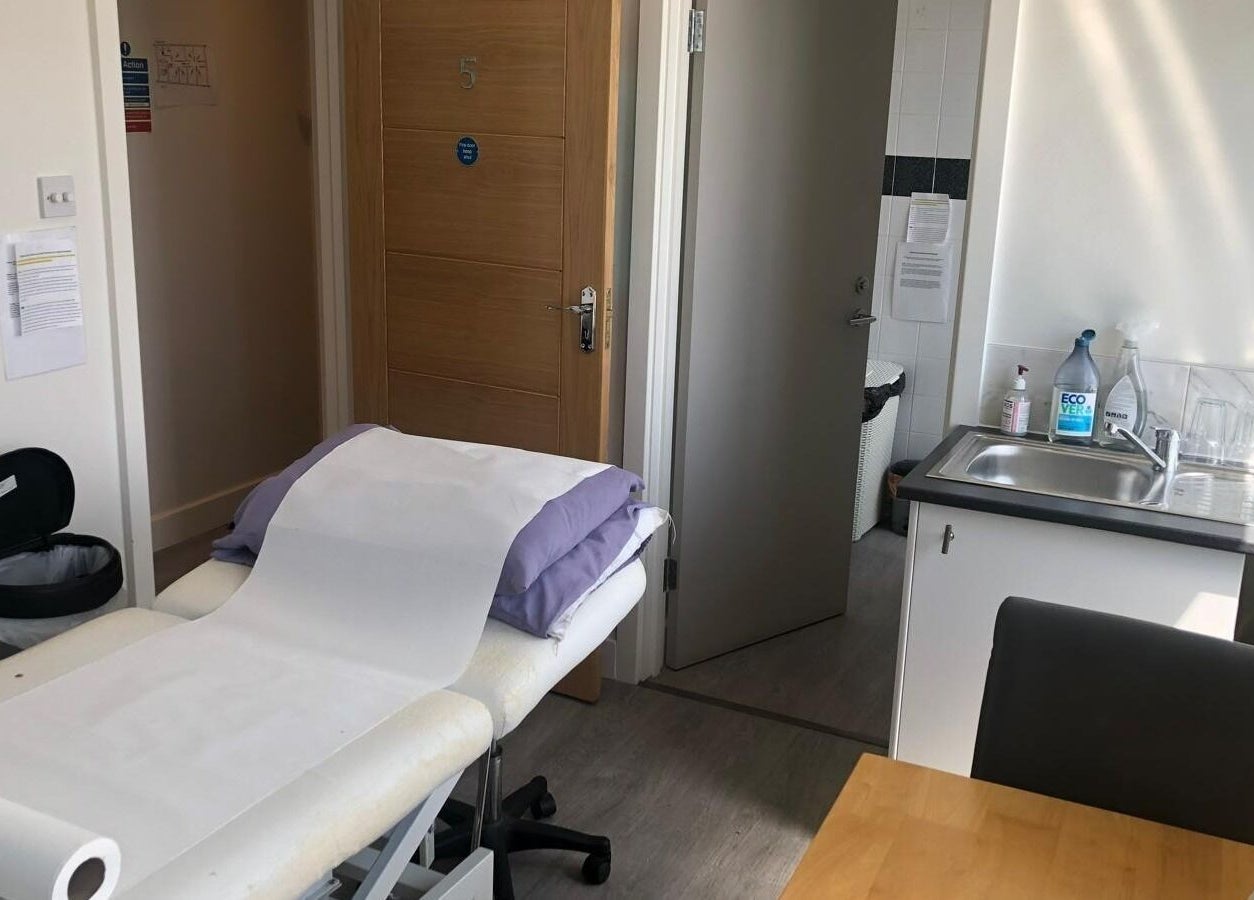 Serene treatment room at Maen (Men) London Clapham, London, England, GB with massage table and sink.