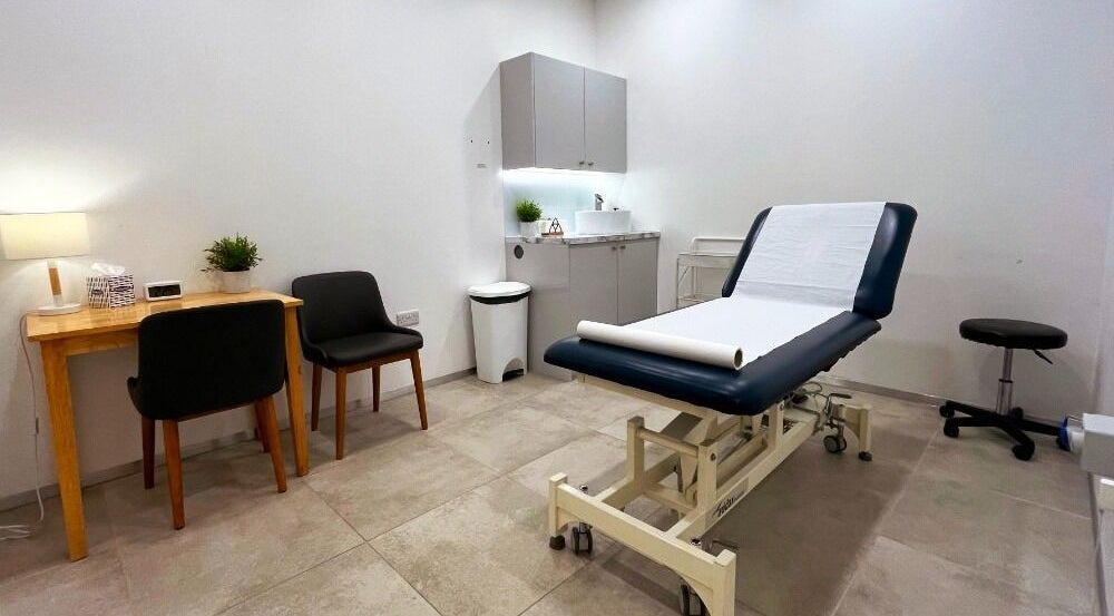 Modern treatment room at Danugur Marylebone, London, England, GB, featuring sleek furniture and professional setup.
