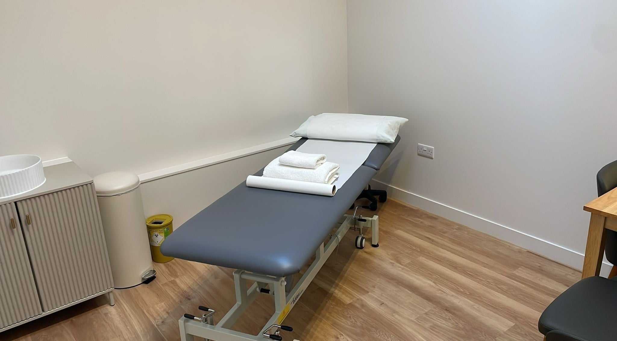 Calm treatment room at Danugur Belgravia -Victoria, London, England, GB with massage bed and fresh towels.