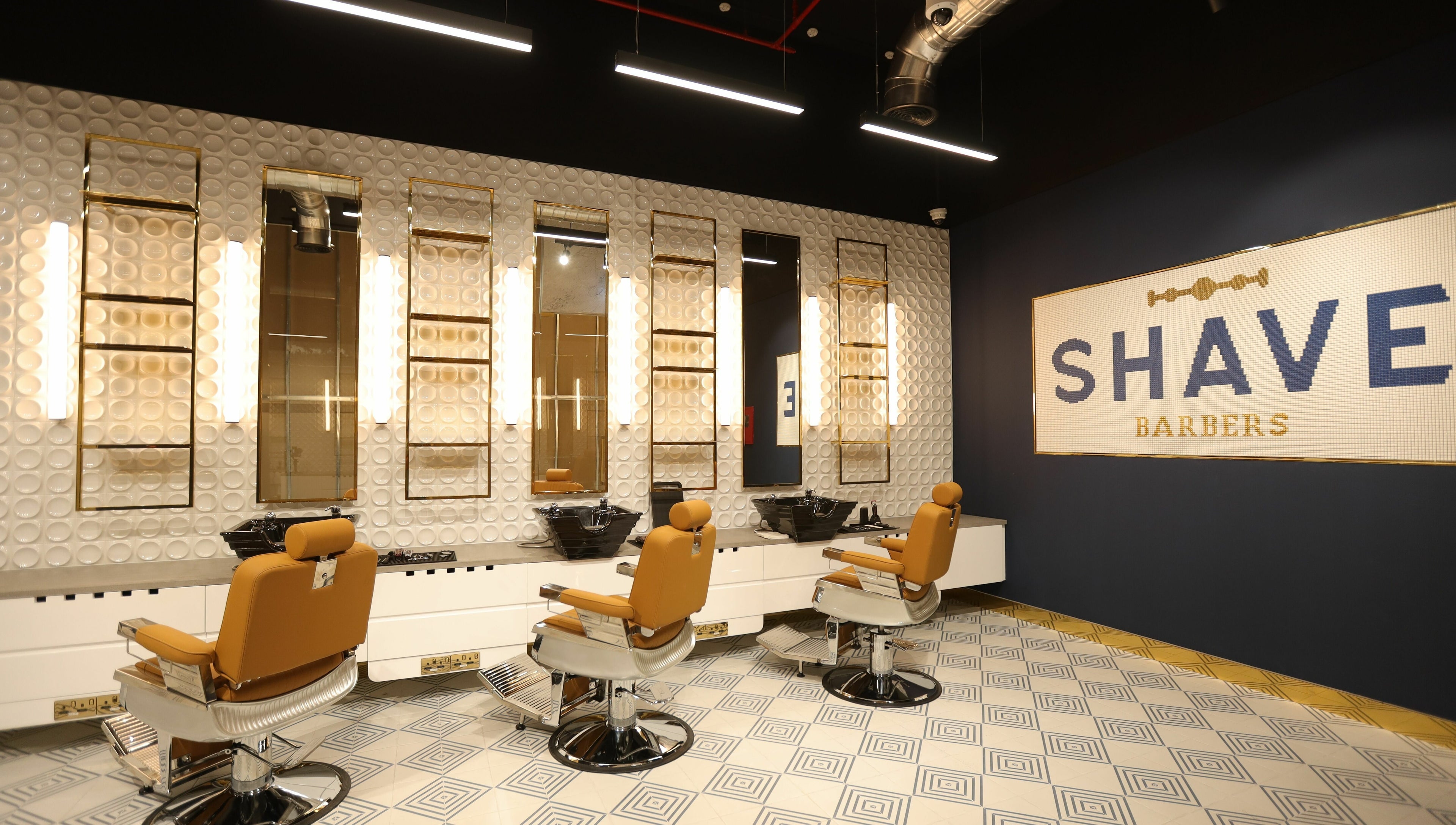 Modern interior of Shave Barbers - City Walk, Dubai, Dubai, AE showcasing sleek barber chairs and stylish decor.