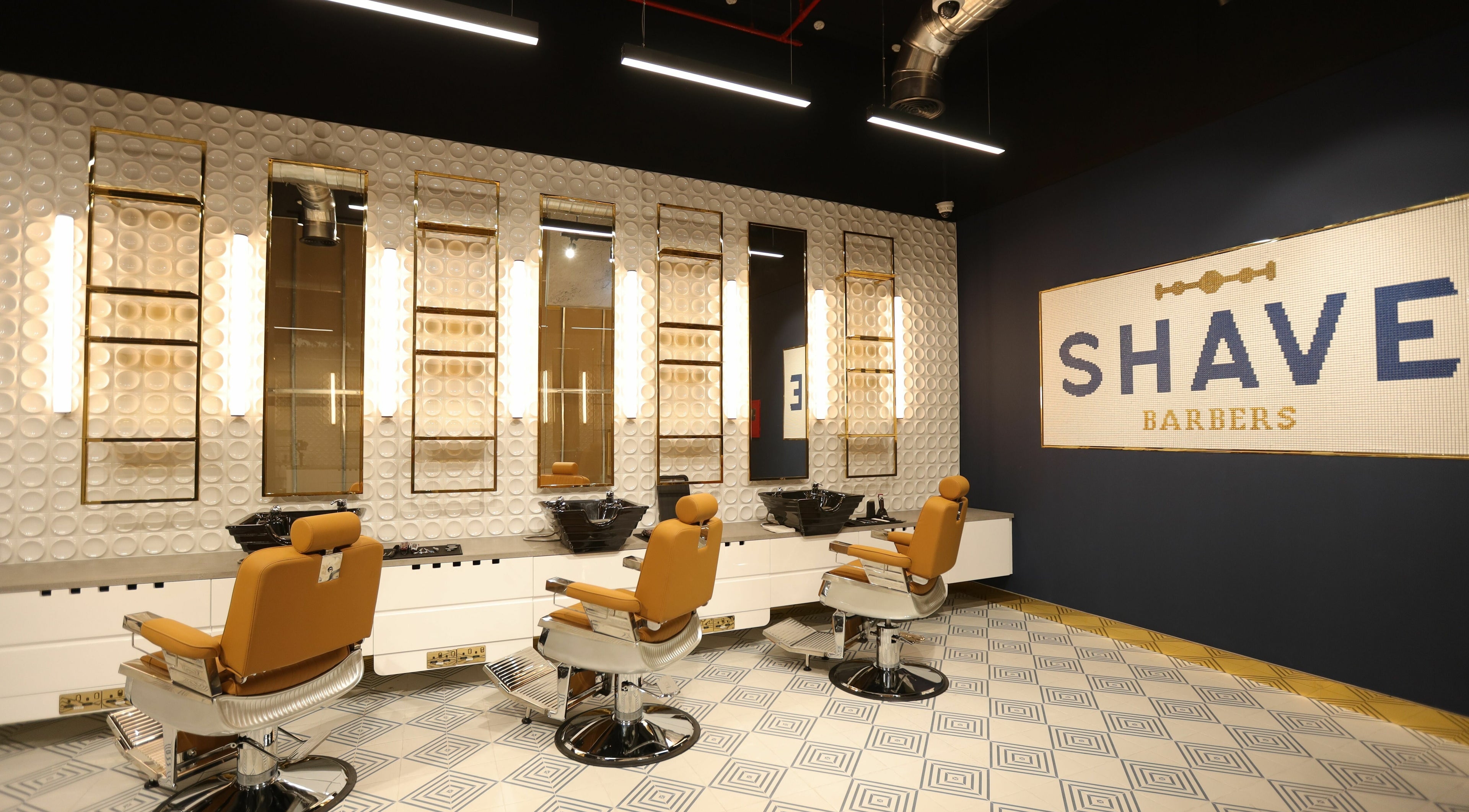 Modern interior of Shave Barbers - City Walk, Dubai, Dubai, AE showcasing sleek barber chairs and stylish decor.