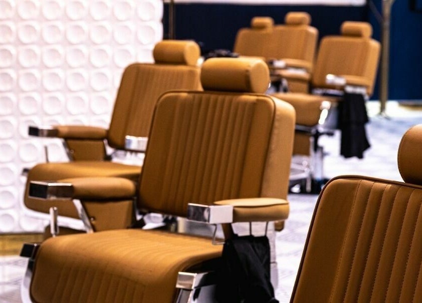 Luxurious barber chairs at Shave Barbers - City Walk, Dubai, Dubai, AE. Modern comfort in a stylish setting.