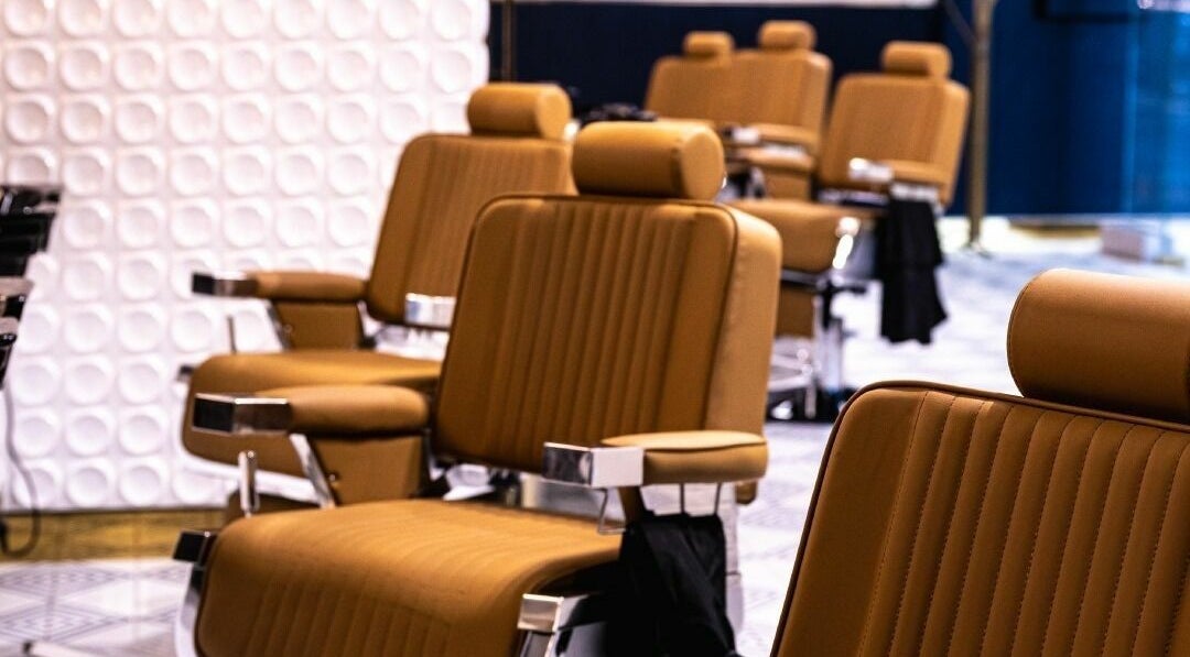 Luxurious barber chairs at Shave Barbers - City Walk, Dubai, Dubai, AE. Modern comfort in a stylish setting.