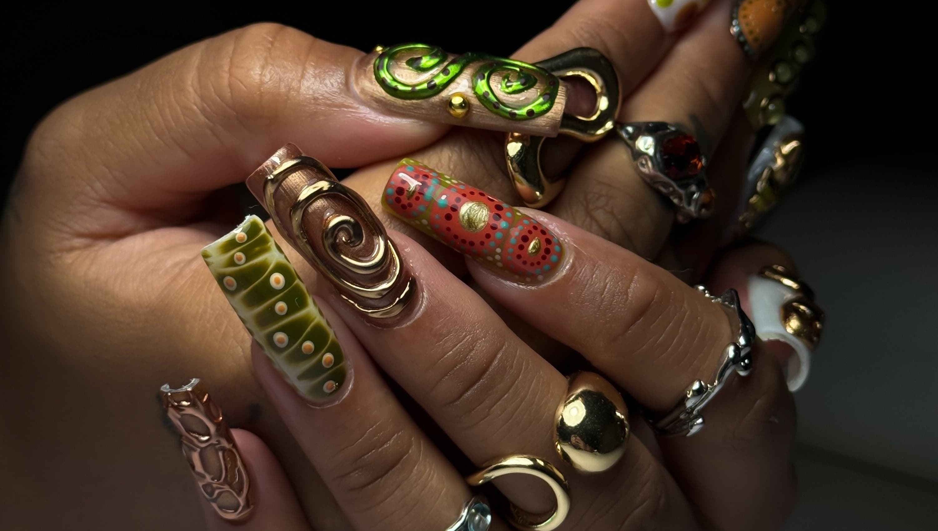 Intricate nail art with metallic accents at Cupid Nail Studio, Varsity Lakes, Queensland, AU.