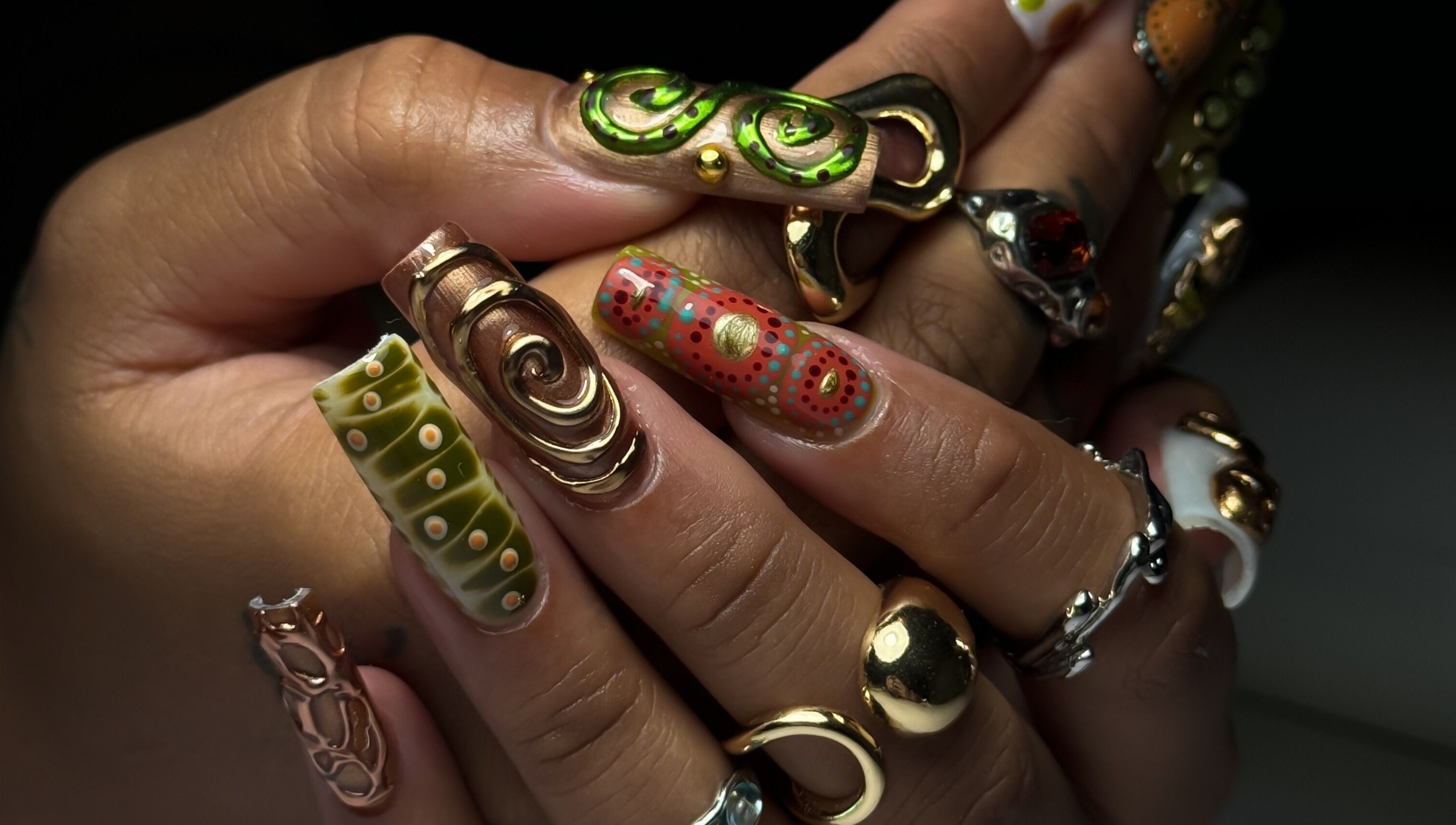 Intricate nail art with metallic accents at Cupid Nail Studio, Varsity Lakes, Queensland, AU.