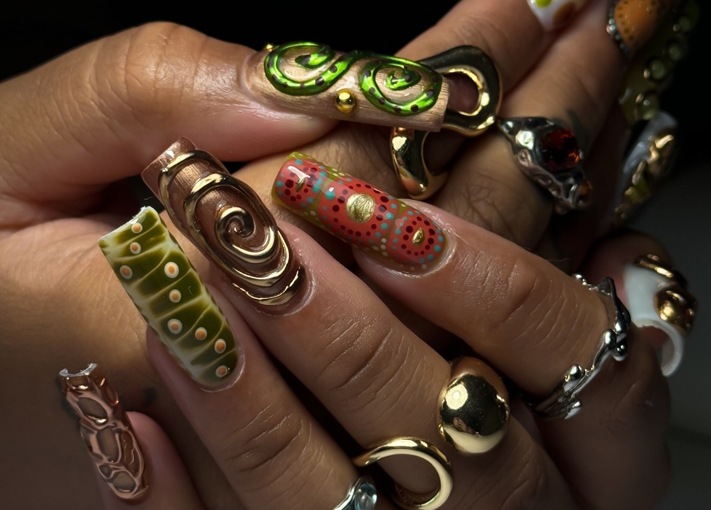 Intricate nail art with metallic accents at Cupid Nail Studio, Varsity Lakes, Queensland, AU.