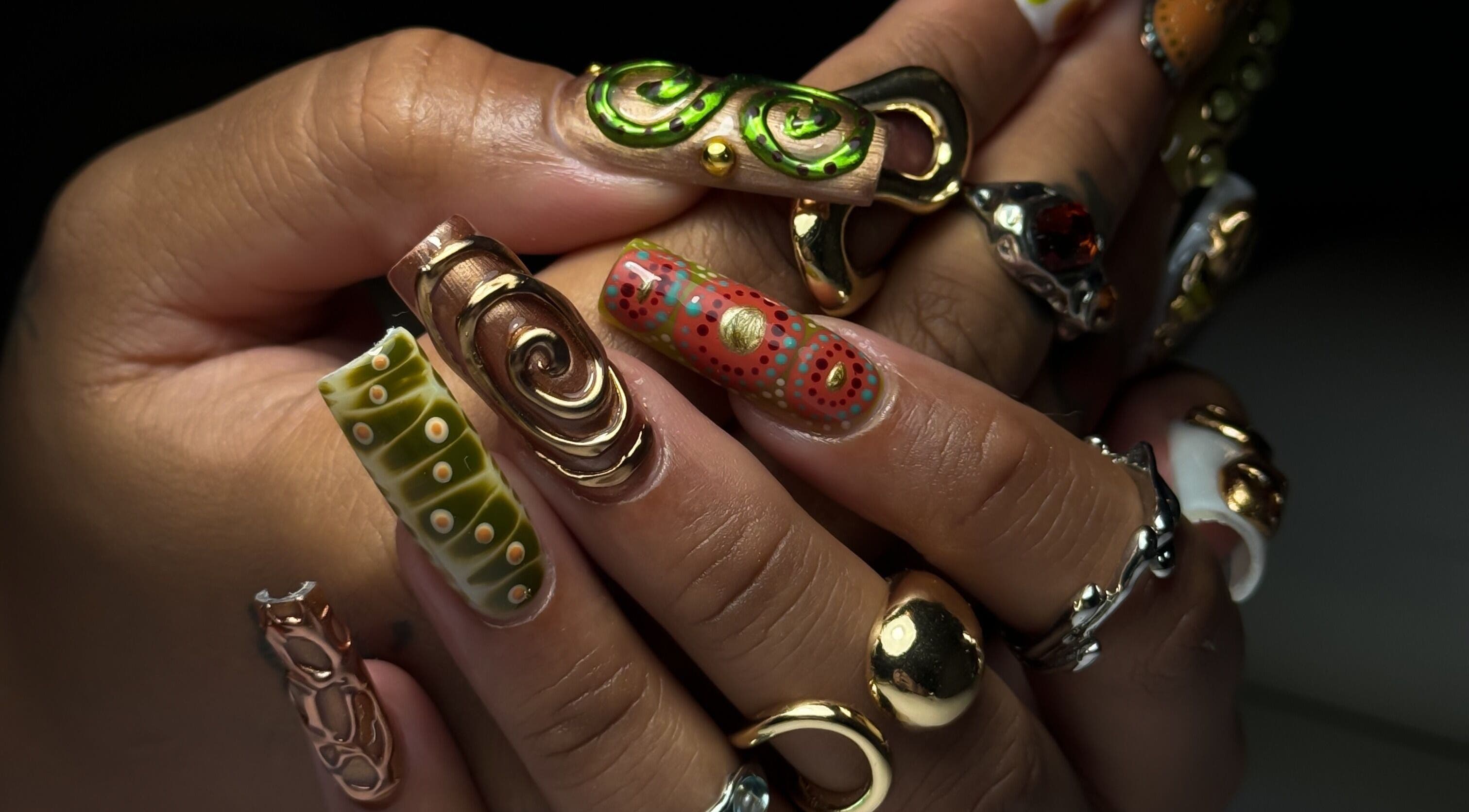 Intricate nail art with metallic accents at Cupid Nail Studio, Varsity Lakes, Queensland, AU.