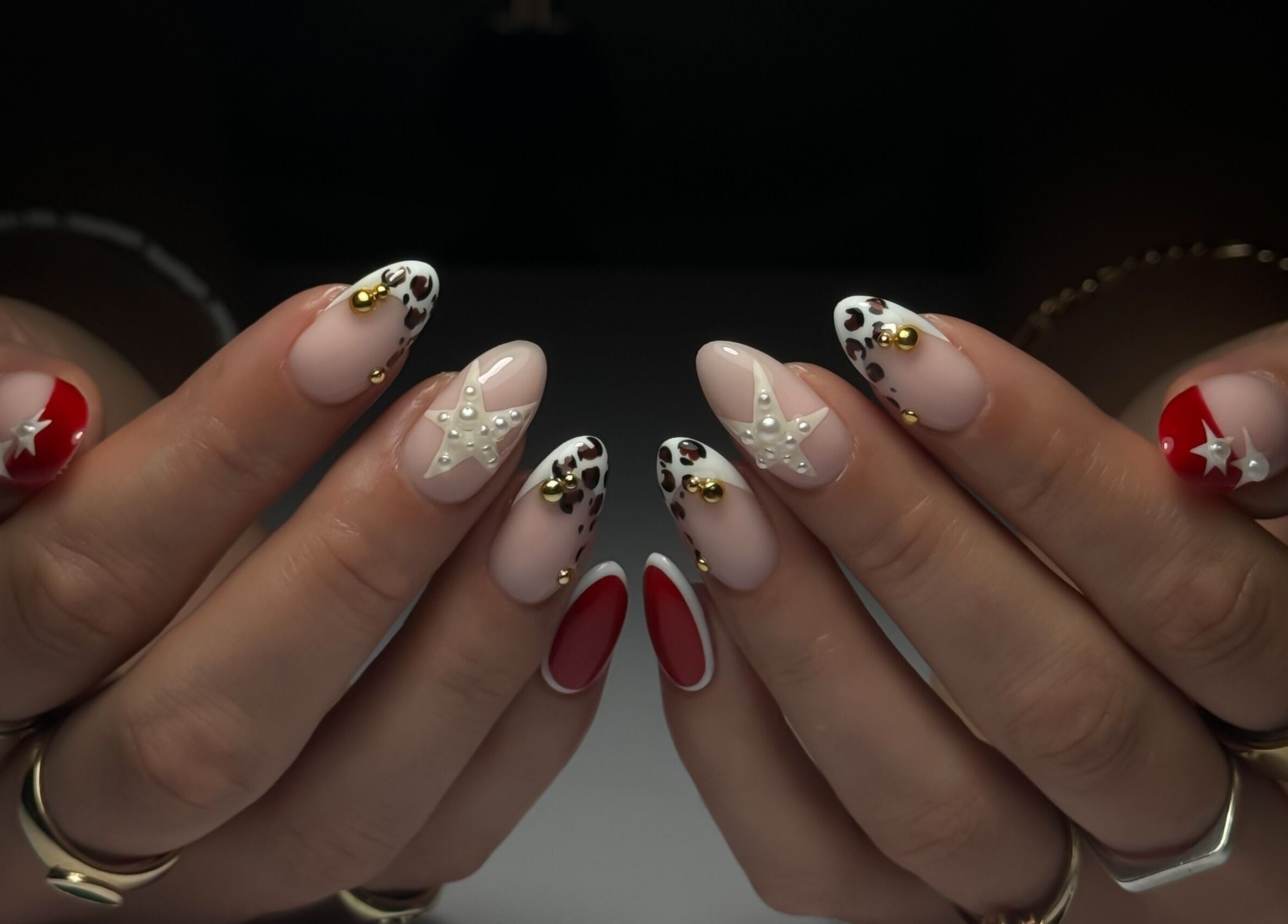 Intricate nail art with stars at Cupid Nail Studio, Varsity Lakes, Queensland, AU.