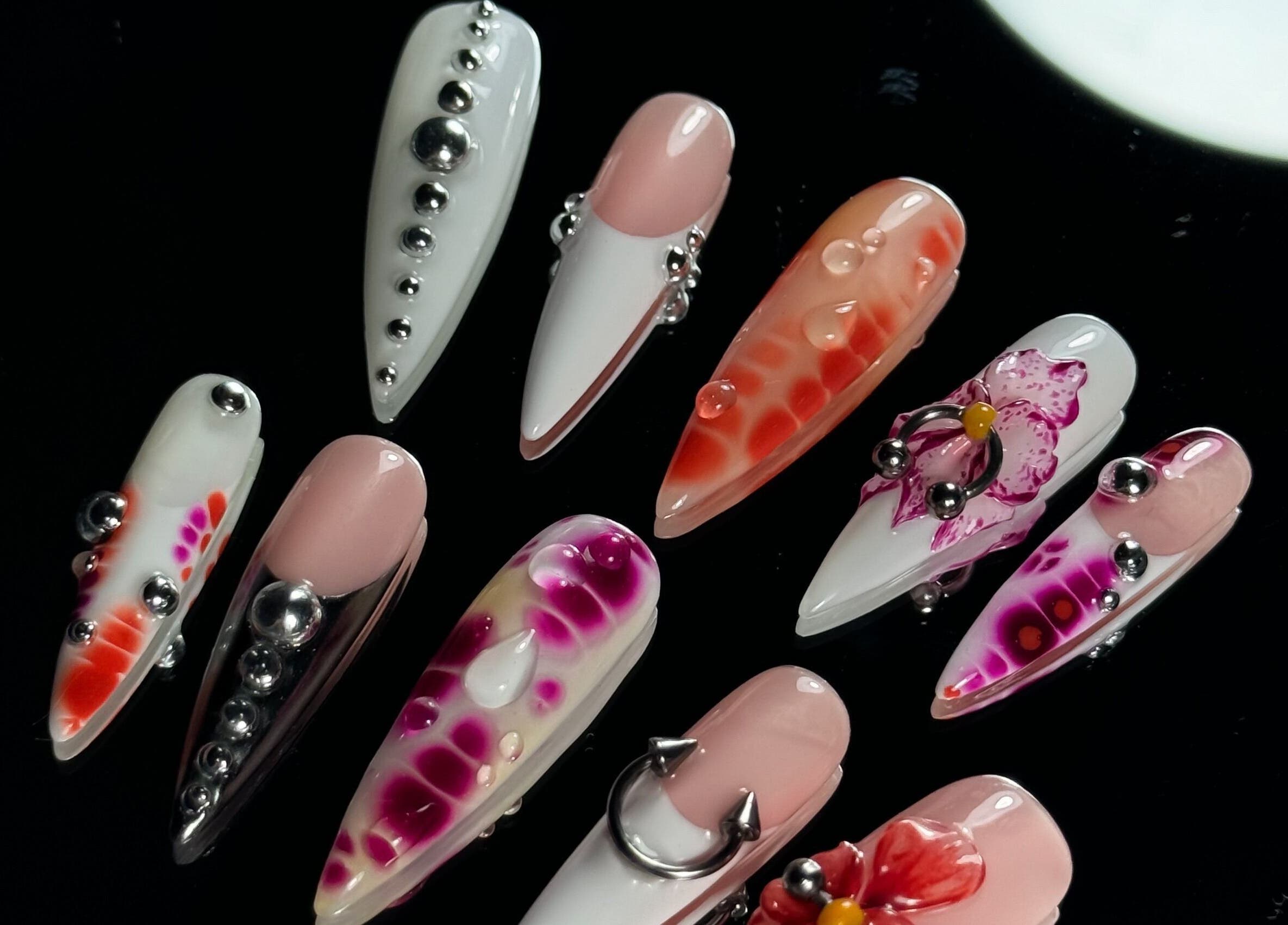 Elegant nail art with colorful designs at Cupid Nail Studio, Varsity Lakes, Queensland, AU.